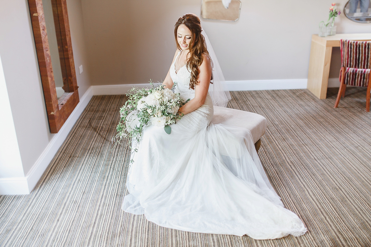 Stephanie wore a backless lace dress for her outdoor Spring wedding held at Hyde House country house hotel. Images by White Stag Photography.