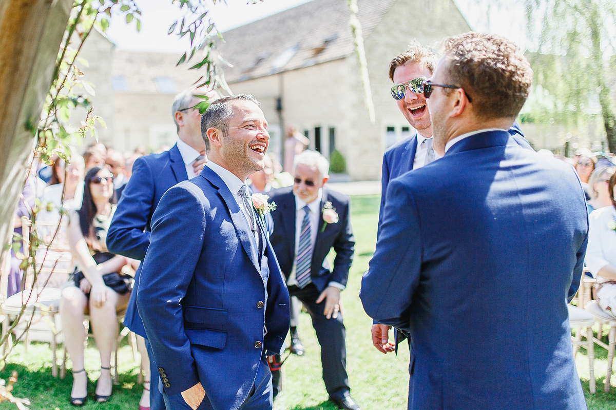 Stephanie wore a backless lace dress for her outdoor Spring wedding held at Hyde House country house hotel. Images by White Stag Photography.