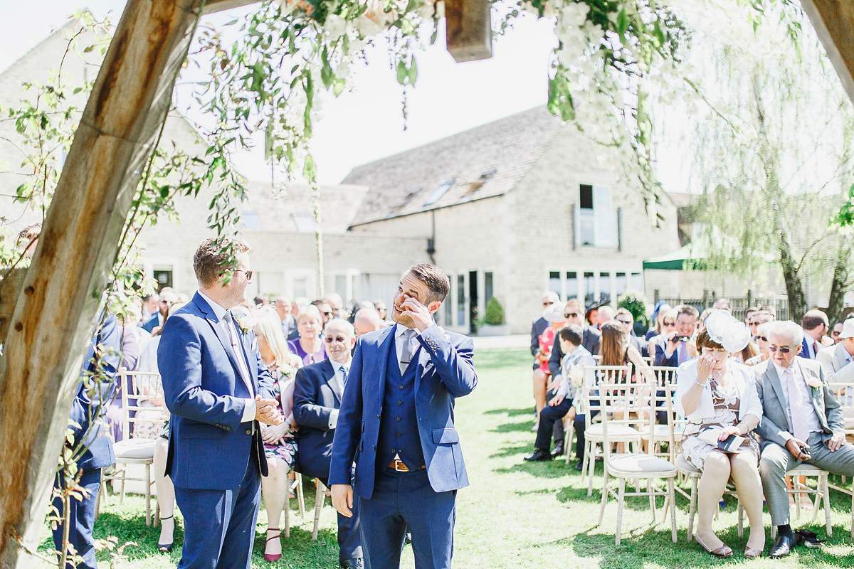 Stephanie wore a backless lace dress for her outdoor Spring wedding held at Hyde House country house hotel. Images by White Stag Photography.