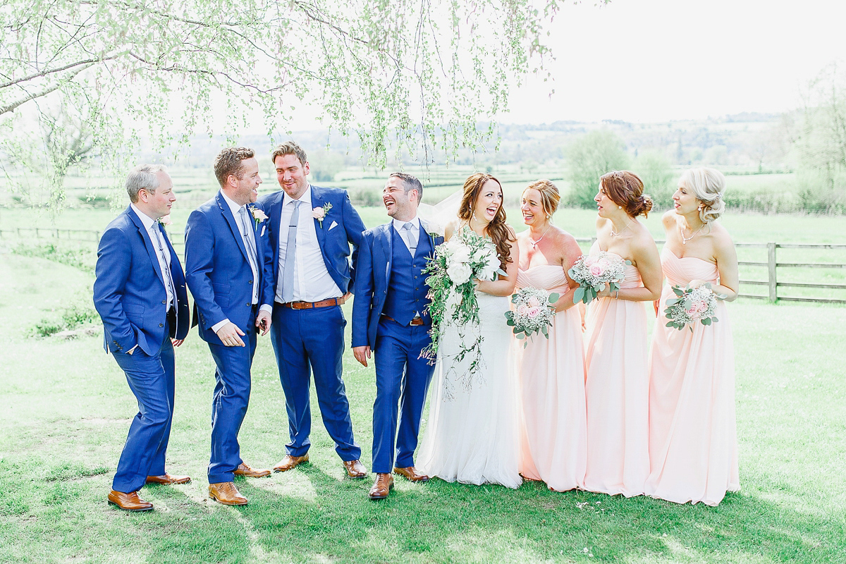 Stephanie wore a backless lace dress for her outdoor Spring wedding held at Hyde House country house hotel. Images by White Stag Photography.