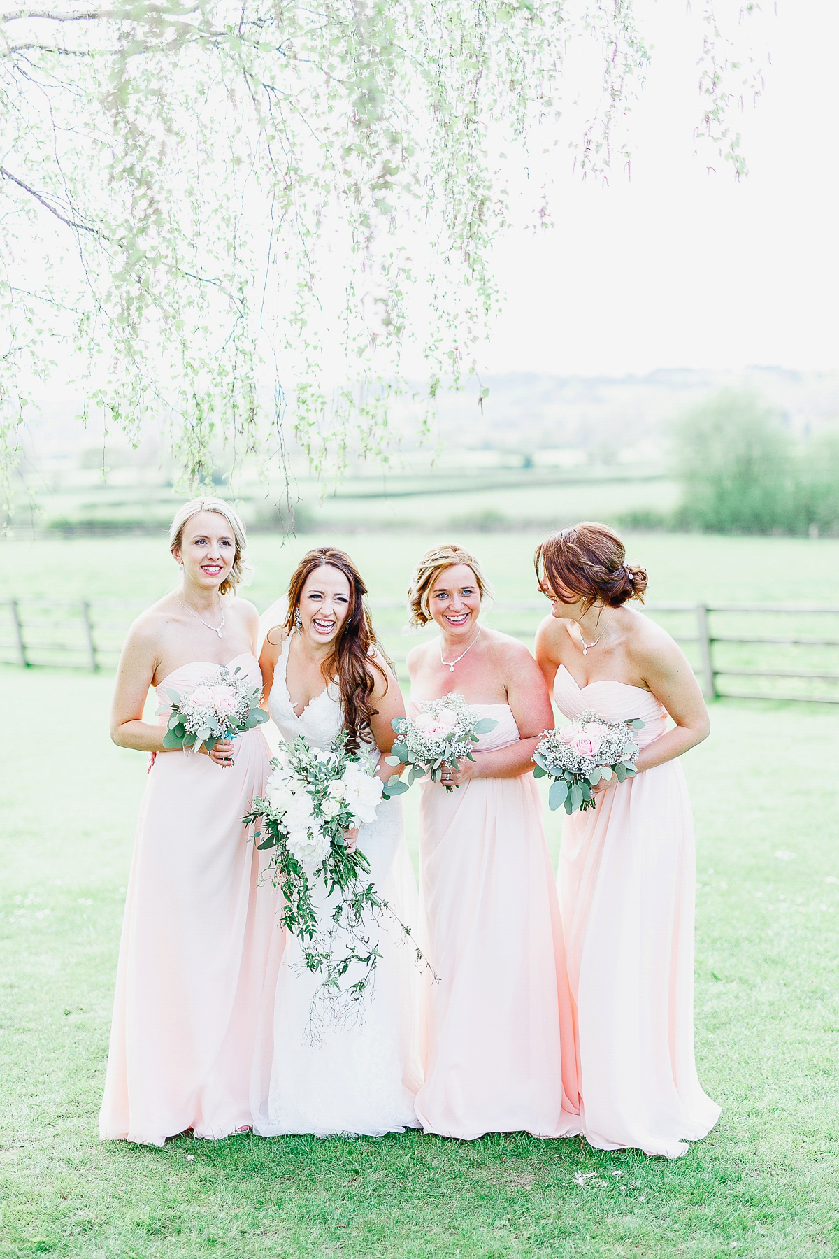 Stephanie wore a backless lace dress for her outdoor Spring wedding held at Hyde House country house hotel. Images by White Stag Photography.