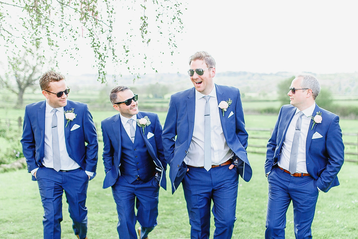 Stephanie wore a backless lace dress for her outdoor Spring wedding held at Hyde House country house hotel. Images by White Stag Photography.