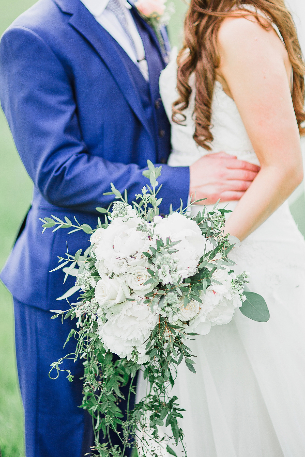 Stephanie wore a backless lace dress for her outdoor Spring wedding held at Hyde House country house hotel. Images by White Stag Photography.