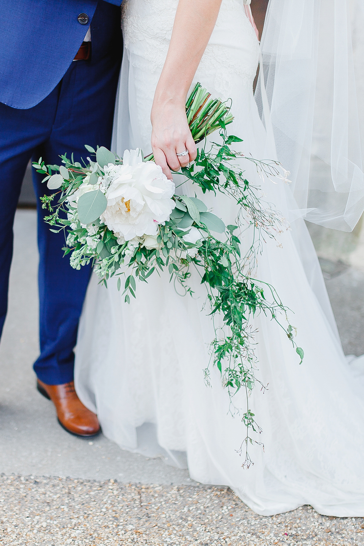 Stephanie wore a backless lace dress for her outdoor Spring wedding held at Hyde House country house hotel. Images by White Stag Photography.