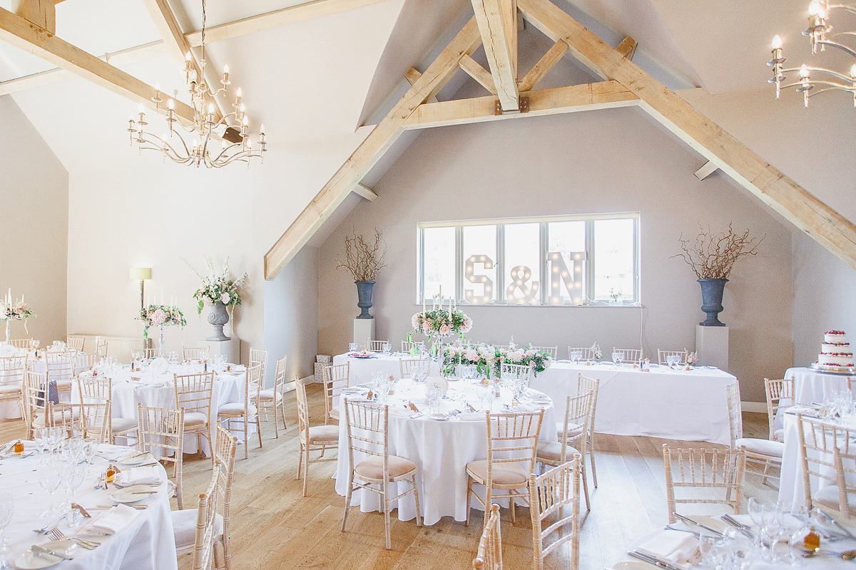 Stephanie wore a backless lace dress for her outdoor Spring wedding held at Hyde House country house hotel. Images by White Stag Photography.