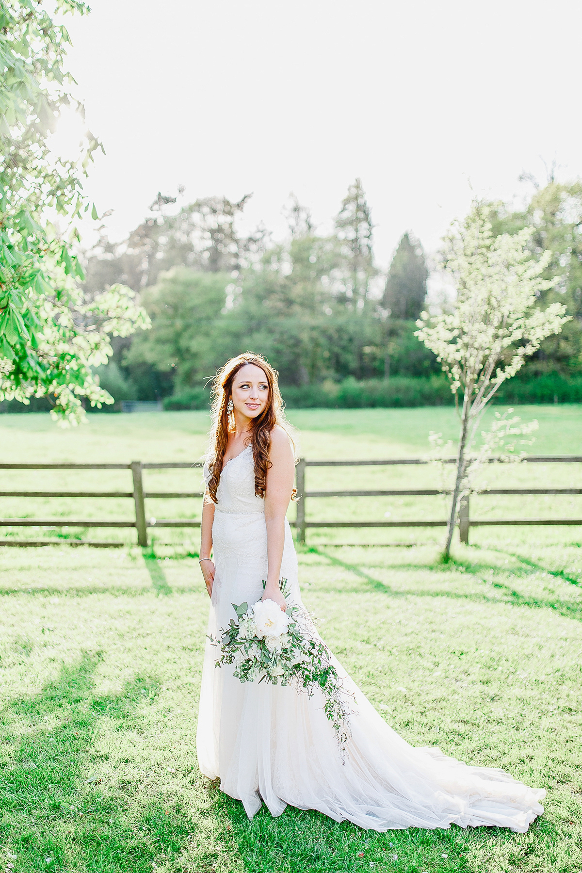 Stephanie wore a backless lace dress for her outdoor Spring wedding held at Hyde House country house hotel. Images by White Stag Photography.