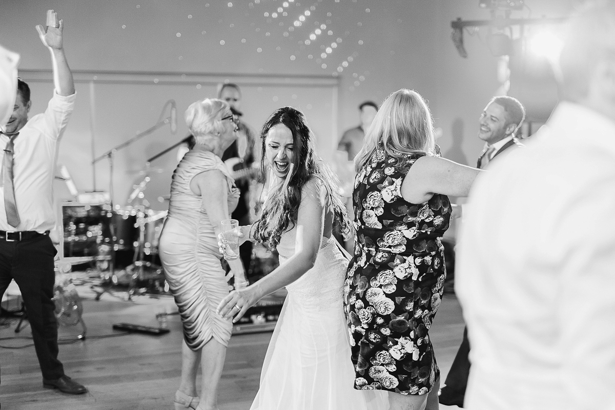 Stephanie wore a backless lace dress for her outdoor Spring wedding held at Hyde House country house hotel. Images by White Stag Photography.