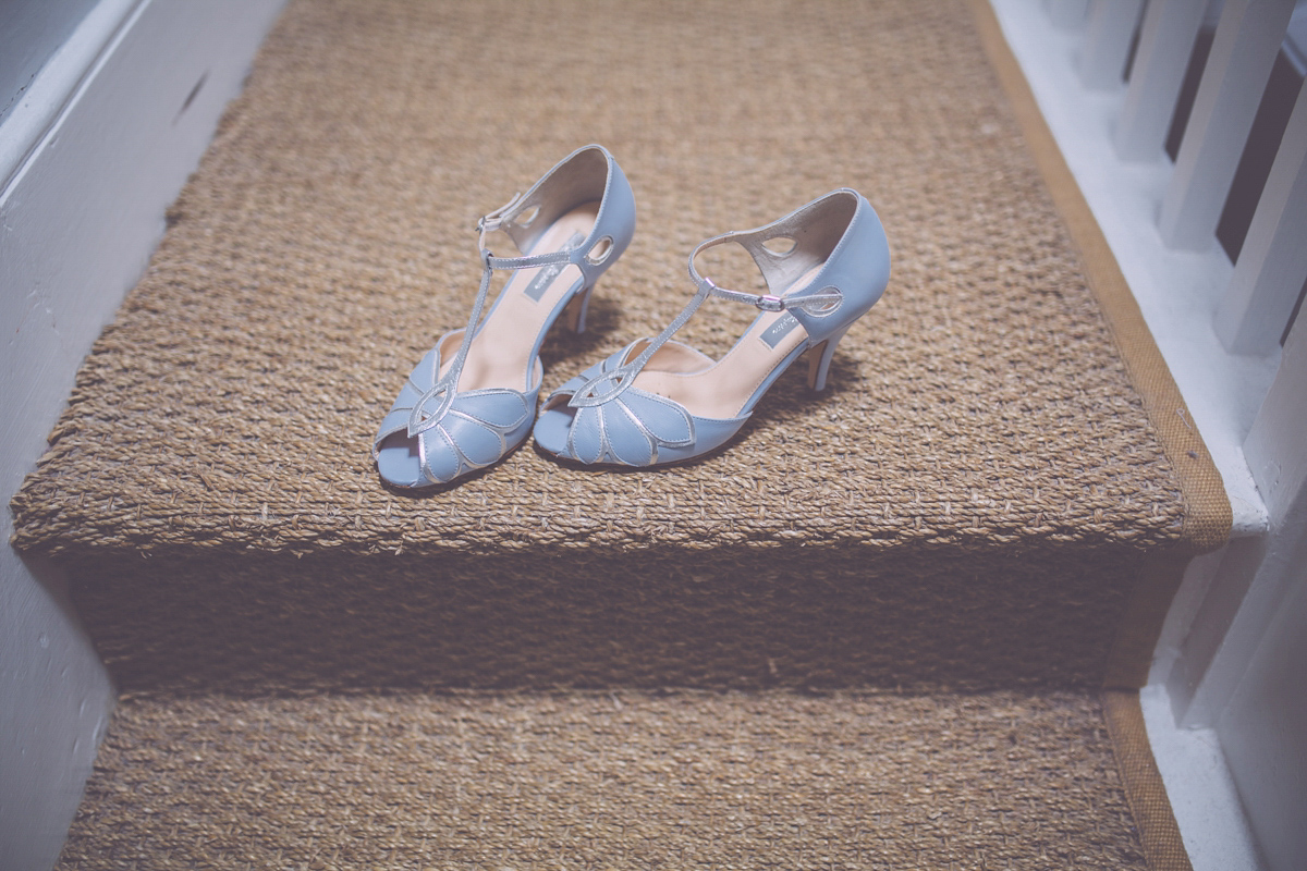 Georgie wore a 1950's inspired Essense of Australia gown for her rustic and rural Somerset barn wedding. Photography by Naomi Jane.