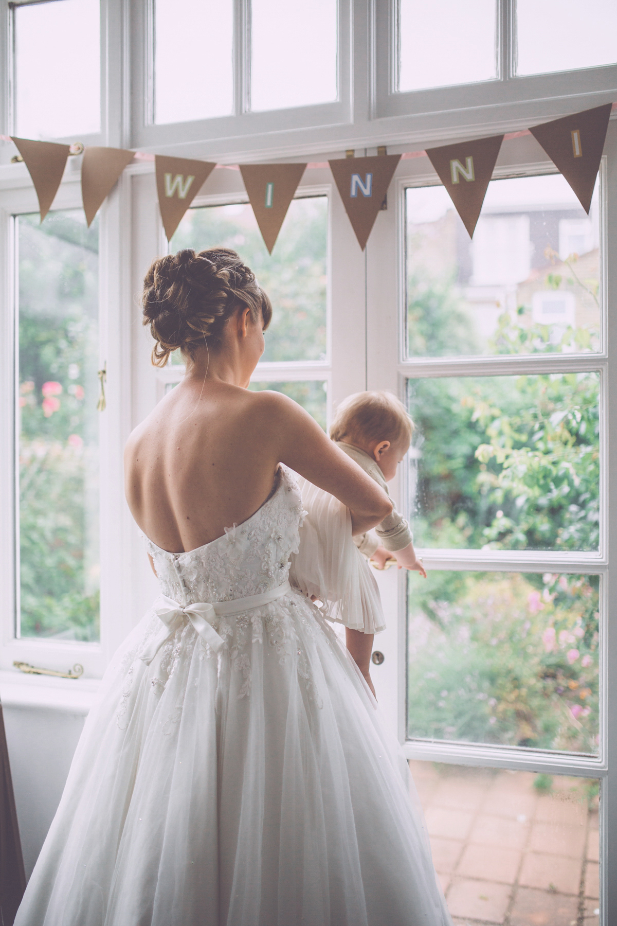 Georgie wore a 1950's inspired Essense of Australia gown for her rustic and rural Somerset barn wedding. Photography by Naomi Jane.