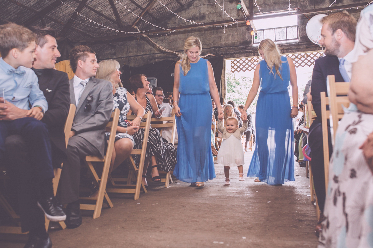 Georgie wore a 1950's inspired Essense of Australia gown for her rustic and rural Somerset barn wedding. Photography by Naomi Jane.