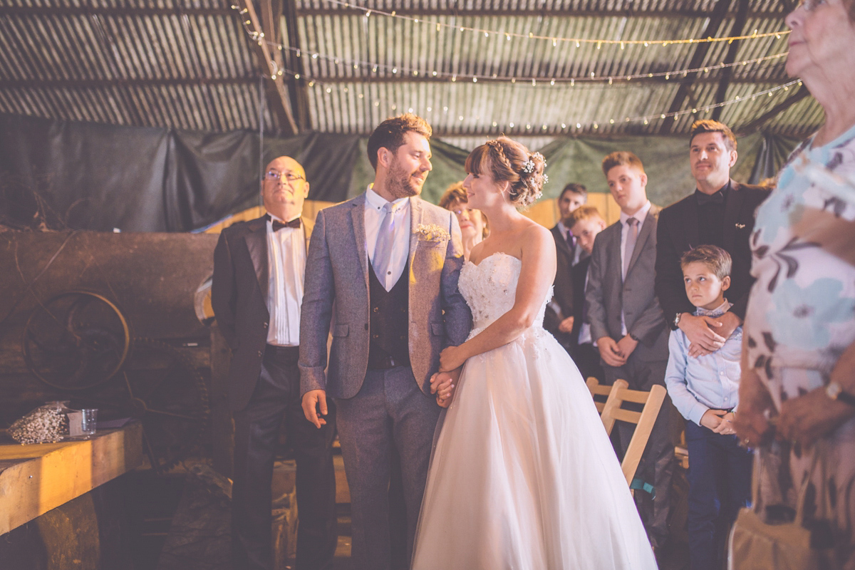 Georgie wore a 1950's inspired Essense of Australia gown for her rustic and rural Somerset barn wedding. Photography by Naomi Jane.