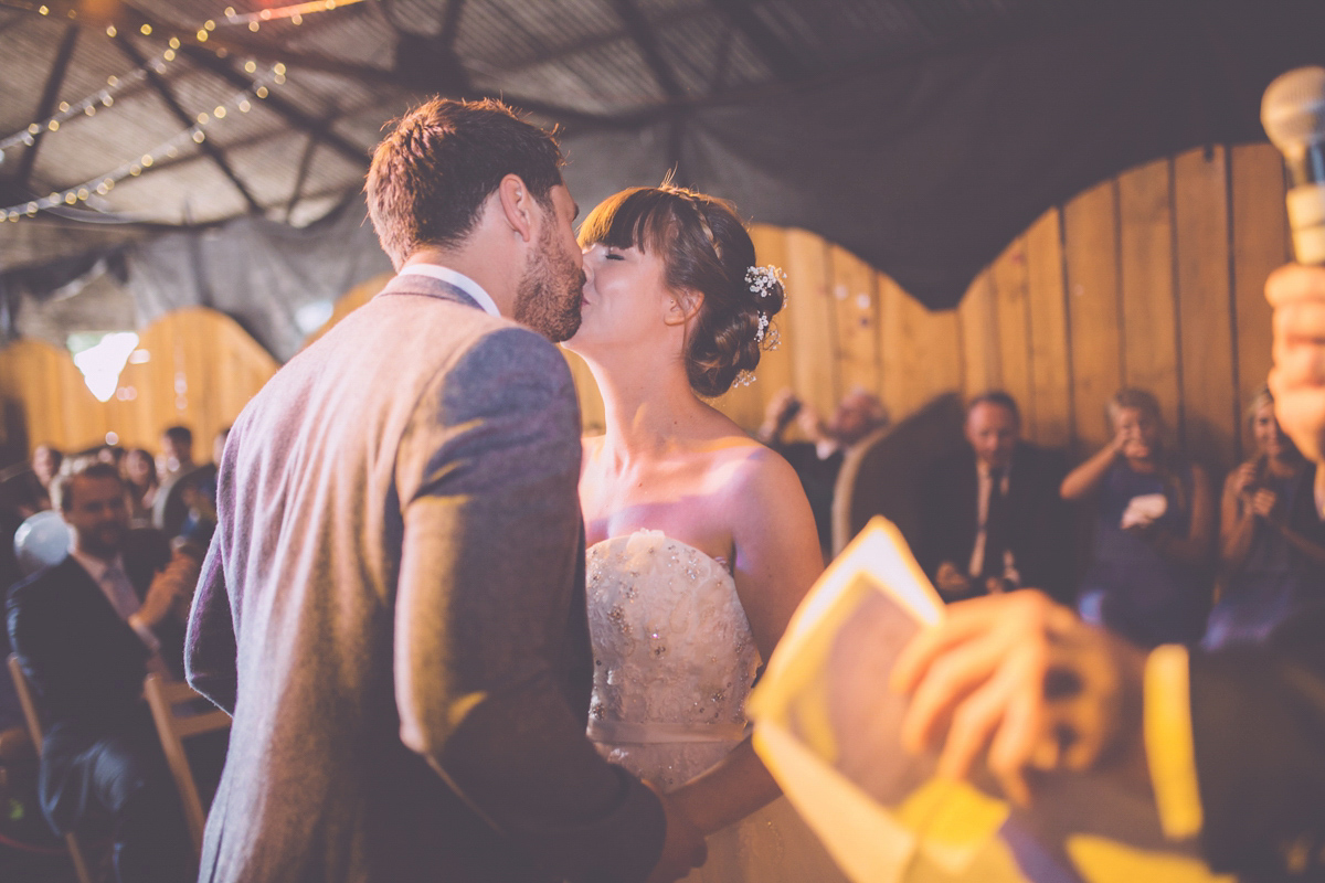 Georgie wore a 1950's inspired Essense of Australia gown for her rustic and rural Somerset barn wedding. Photography by Naomi Jane.