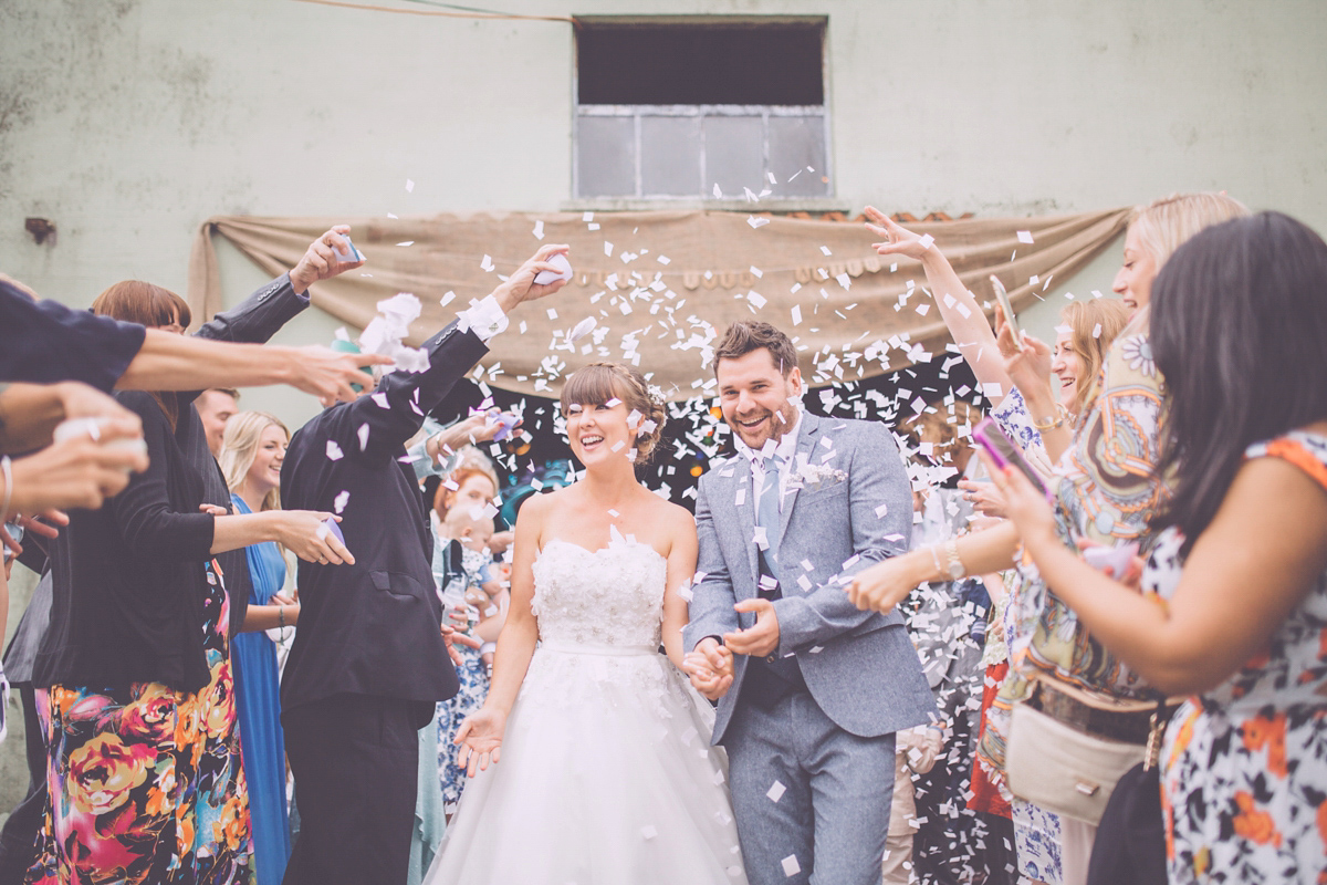 Georgie wore a 1950's inspired Essense of Australia gown for her rustic and rural Somerset barn wedding. Photography by Naomi Jane.