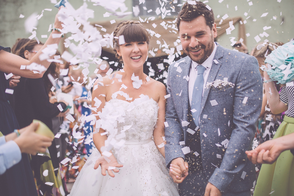 Georgie wore a 1950's inspired Essense of Australia gown for her rustic and rural Somerset barn wedding. Photography by Naomi Jane.