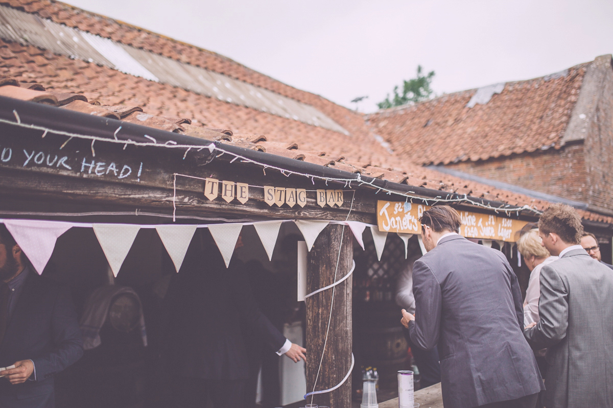 Georgie wore a 1950's inspired Essense of Australia gown for her rustic and rural Somerset barn wedding. Photography by Naomi Jane.