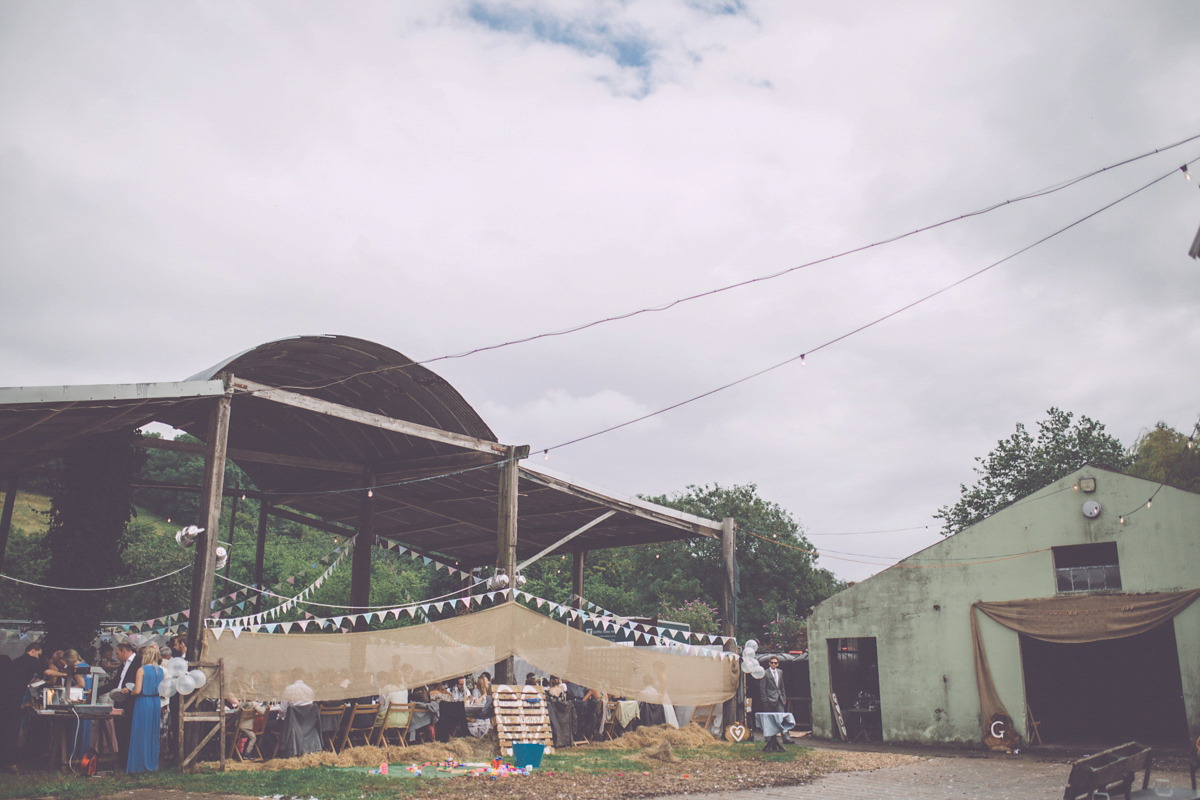 Georgie wore a 1950's inspired Essense of Australia gown for her rustic and rural Somerset barn wedding. Photography by Naomi Jane.