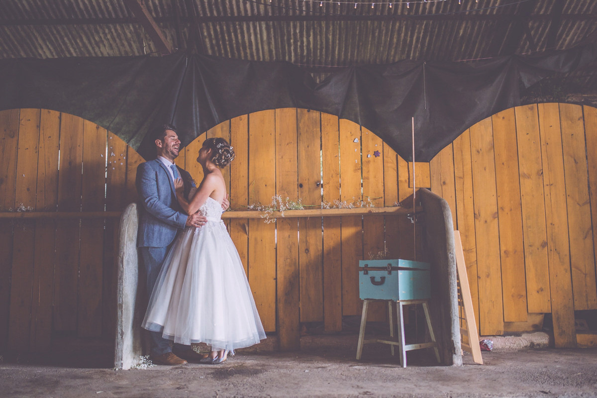 Georgie wore a 1950's inspired Essense of Australia gown for her rustic and rural Somerset barn wedding. Photography by Naomi Jane.