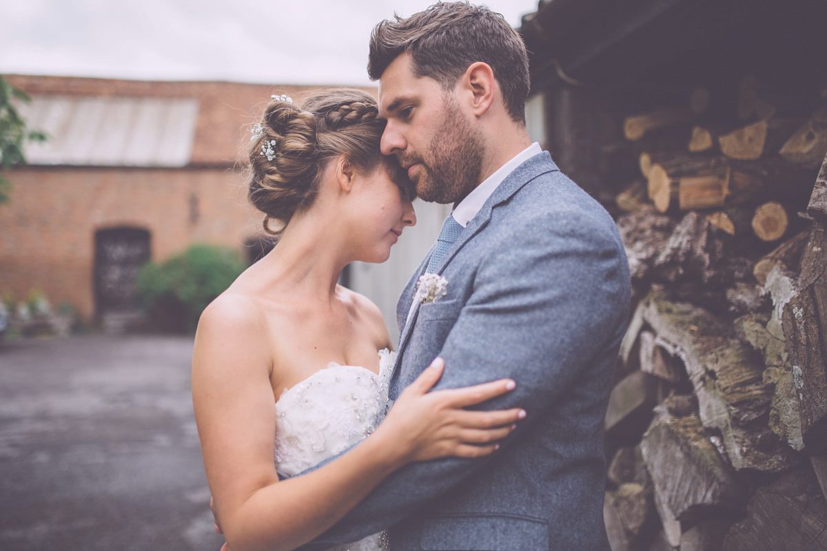 Georgie wore a 1950's inspired Essense of Australia gown for her rustic and rural Somerset barn wedding. Photography by Naomi Jane.