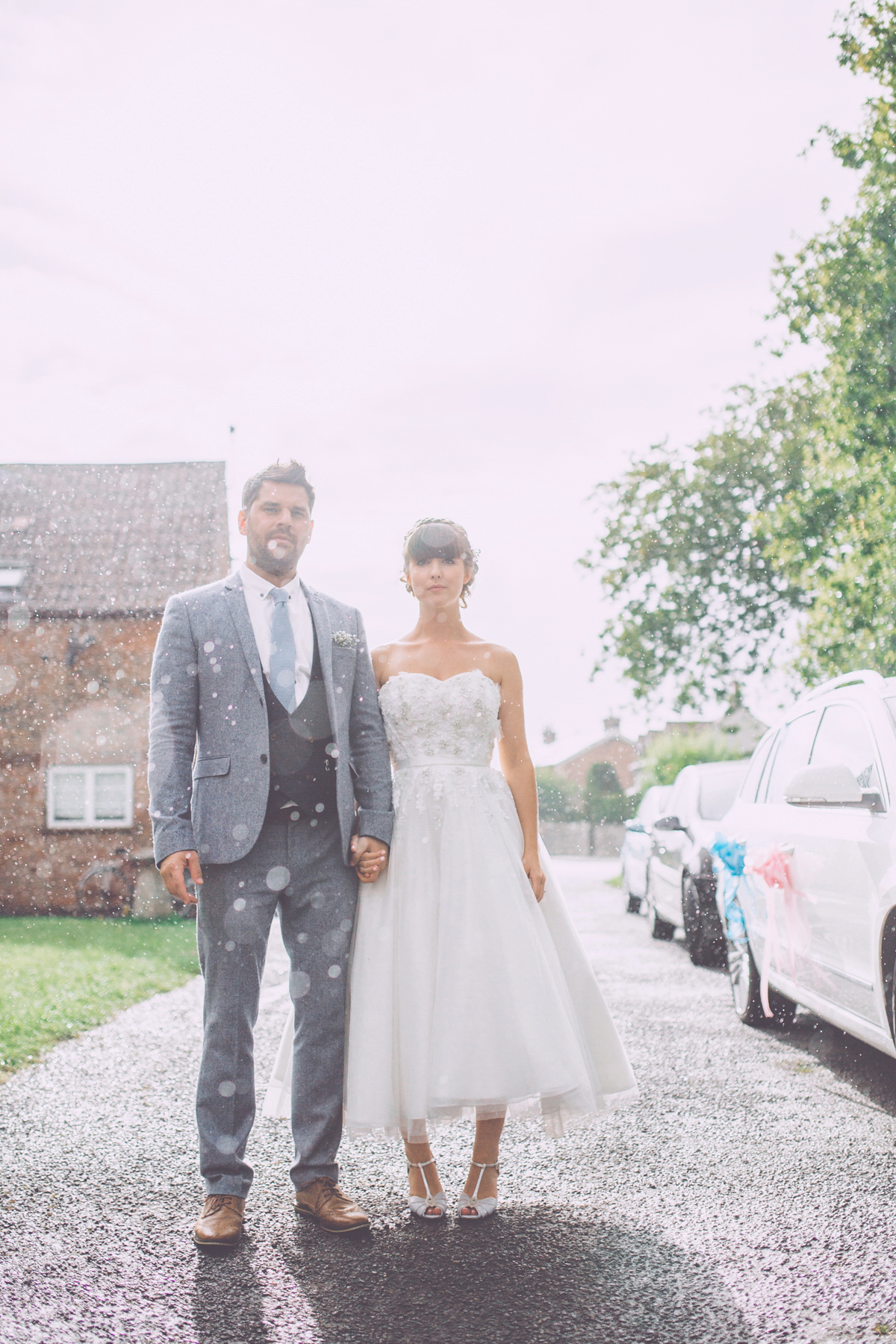 Georgie wore a 1950's inspired Essense of Australia gown for her rustic and rural Somerset barn wedding. Photography by Naomi Jane.