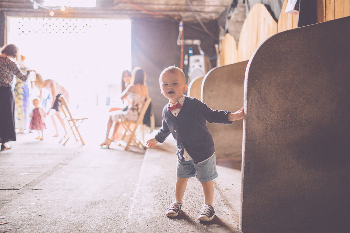 Georgie wore a 1950's inspired Essense of Australia gown for her rustic and rural Somerset barn wedding. Photography by Naomi Jane.