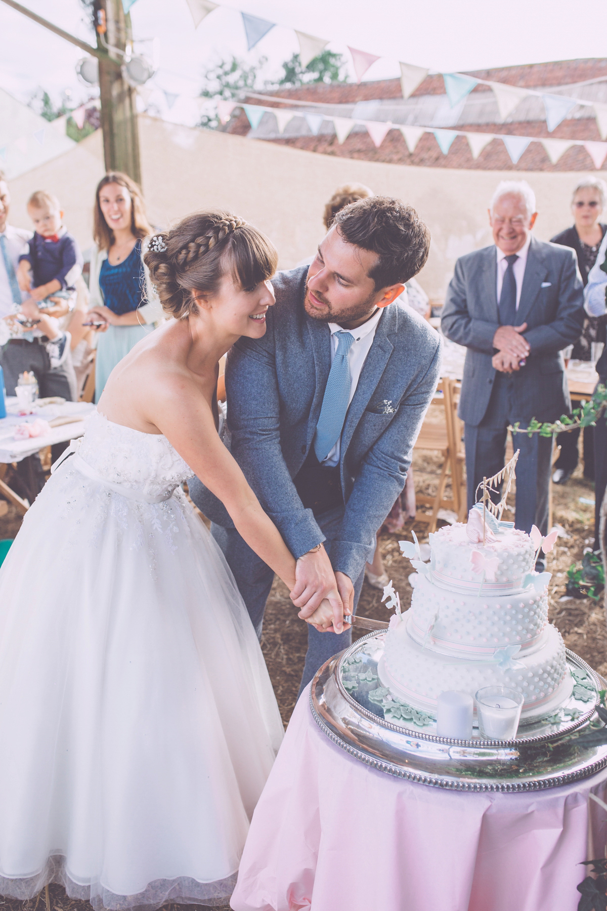 Georgie wore a 1950's inspired Essense of Australia gown for her rustic and rural Somerset barn wedding. Photography by Naomi Jane.