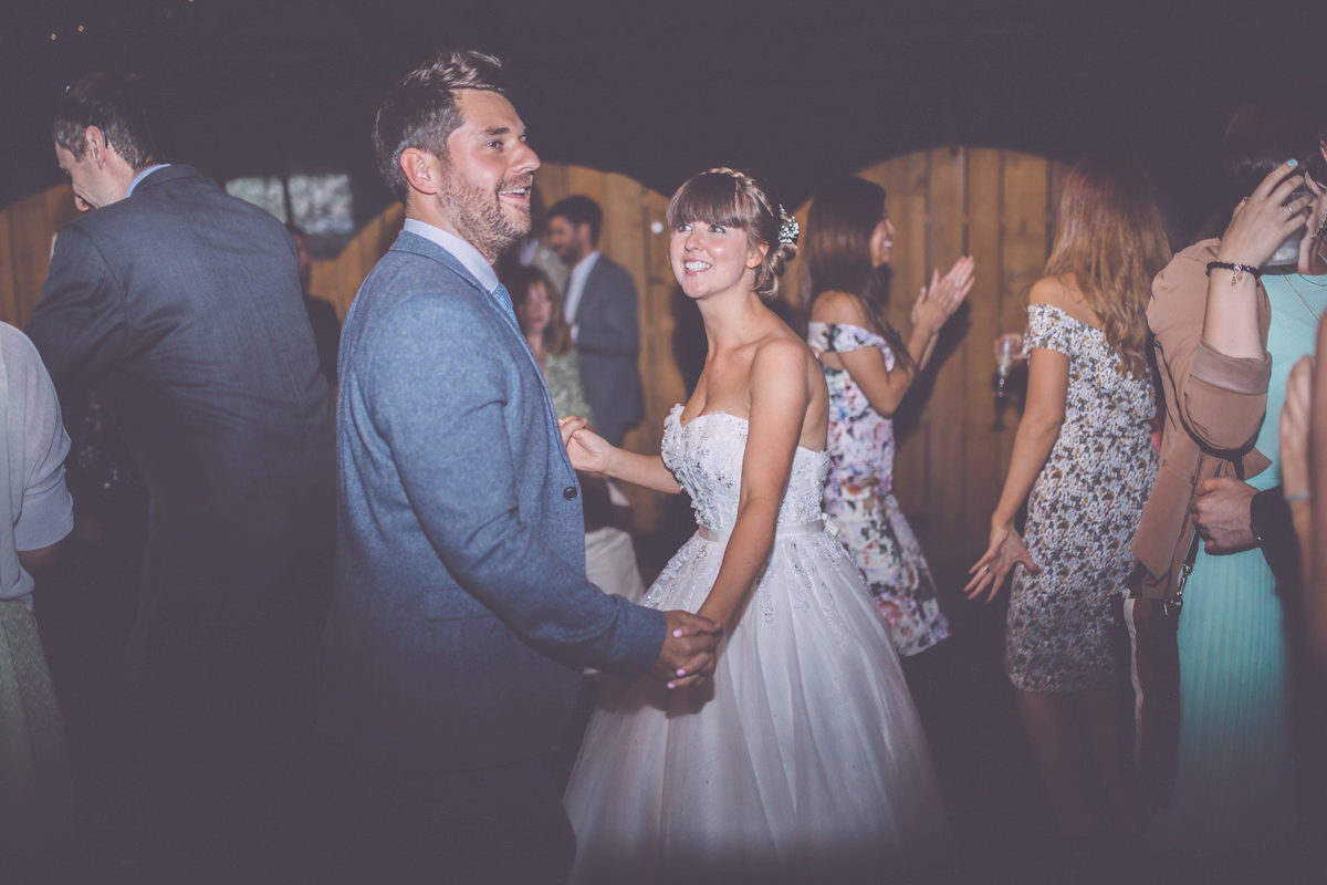 Georgie wore a 1950's inspired Essense of Australia gown for her rustic and rural Somerset barn wedding. Photography by Naomi Jane.