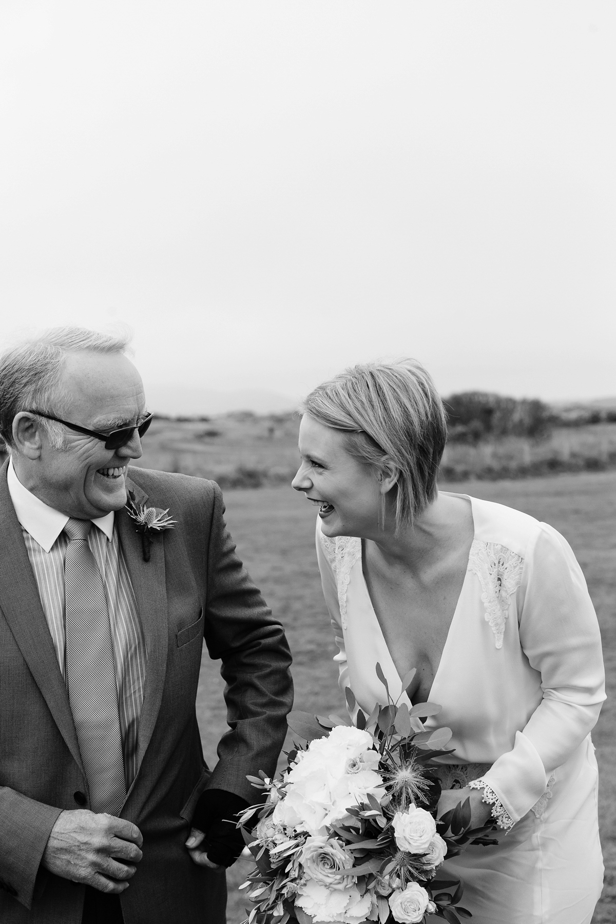 Laura wears a 1970's inspired Stone Cold Fox wedding dress for her laid back and organic beach wedding in Scotland. Photography by Tino and Pip.