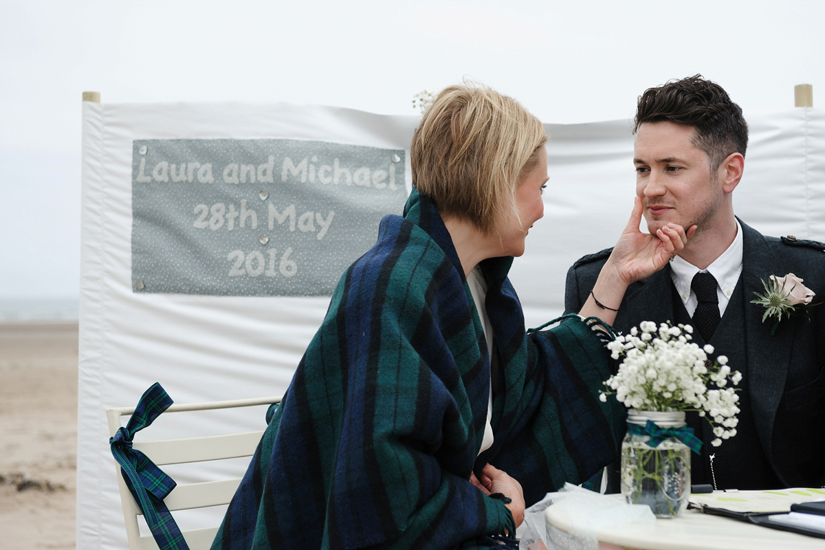 Laura wears a 1970's inspired Stone Cold Fox wedding dress for her laid back and organic beach wedding in Scotland. Photography by Tino and Pip.