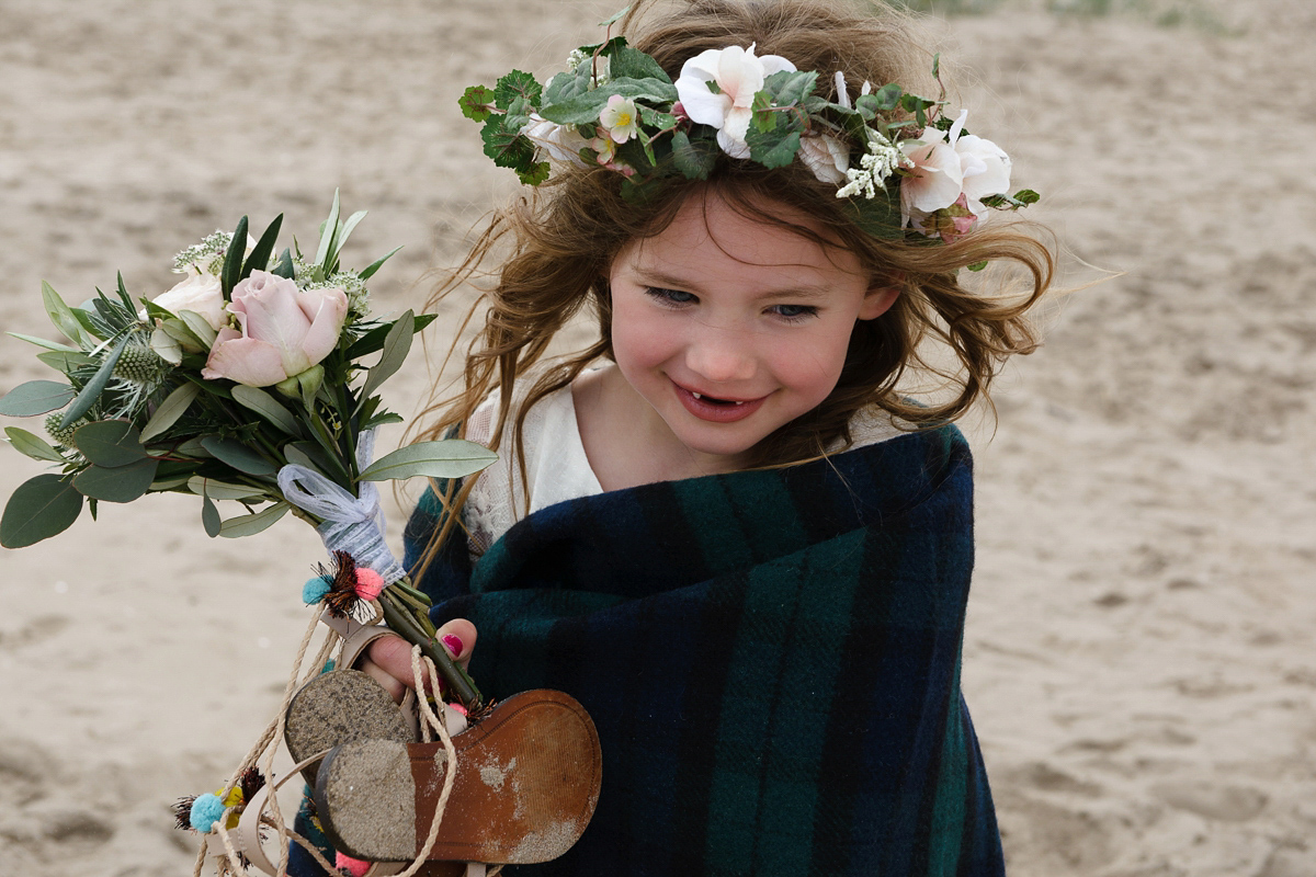 Laura wears a 1970's inspired Stone Cold Fox wedding dress for her laid back and organic beach wedding in Scotland. Photography by Tino and Pip.