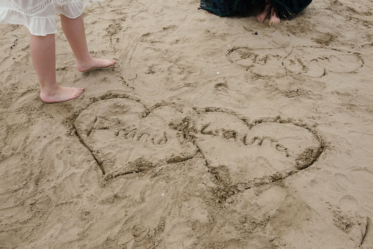 Laura wears a 1970's inspired Stone Cold Fox wedding dress for her laid back and organic beach wedding in Scotland. Photography by Tino and Pip.