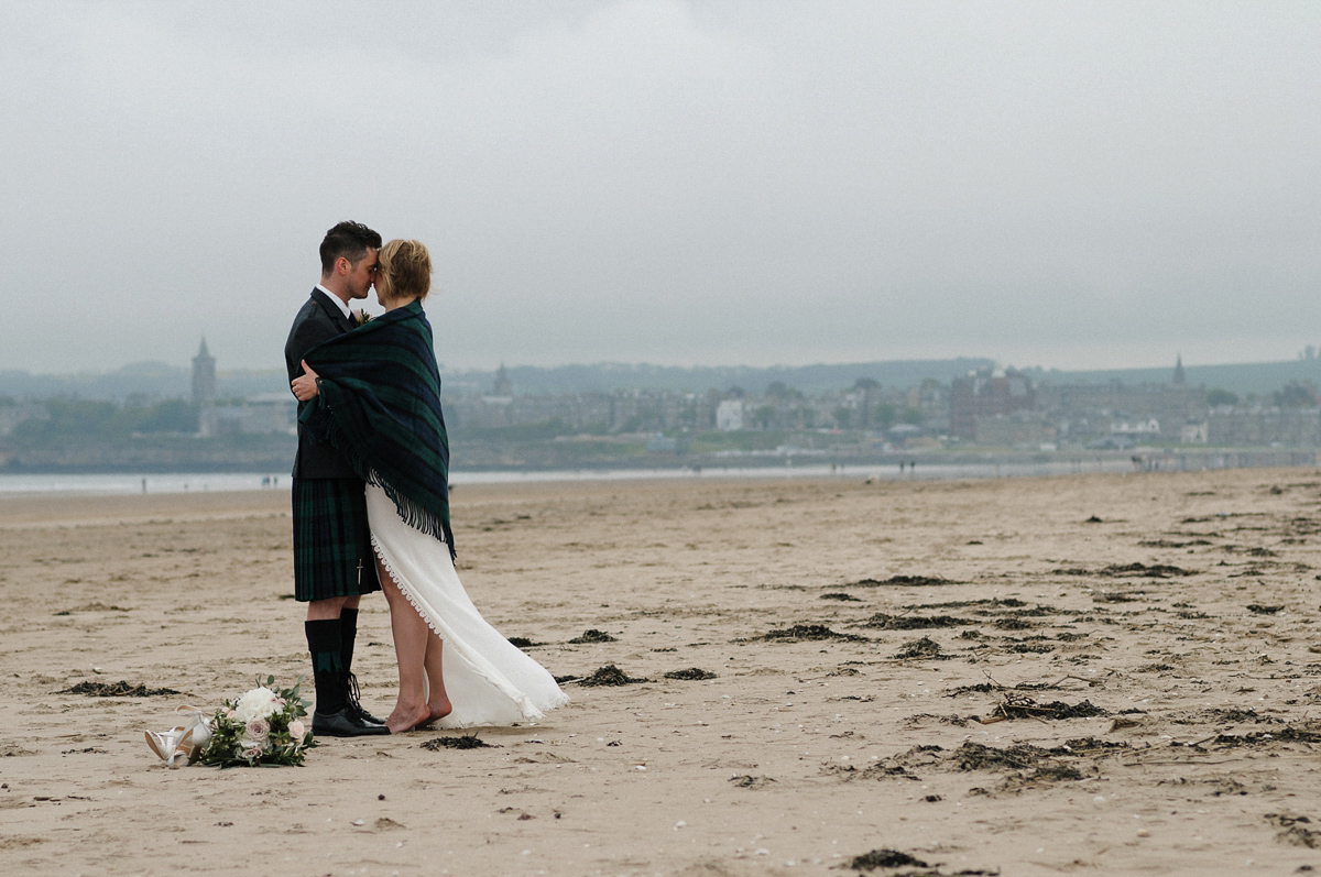 Laura wears a 1970's inspired Stone Cold Fox wedding dress for her laid back and organic beach wedding in Scotland. Photography by Tino and Pip.