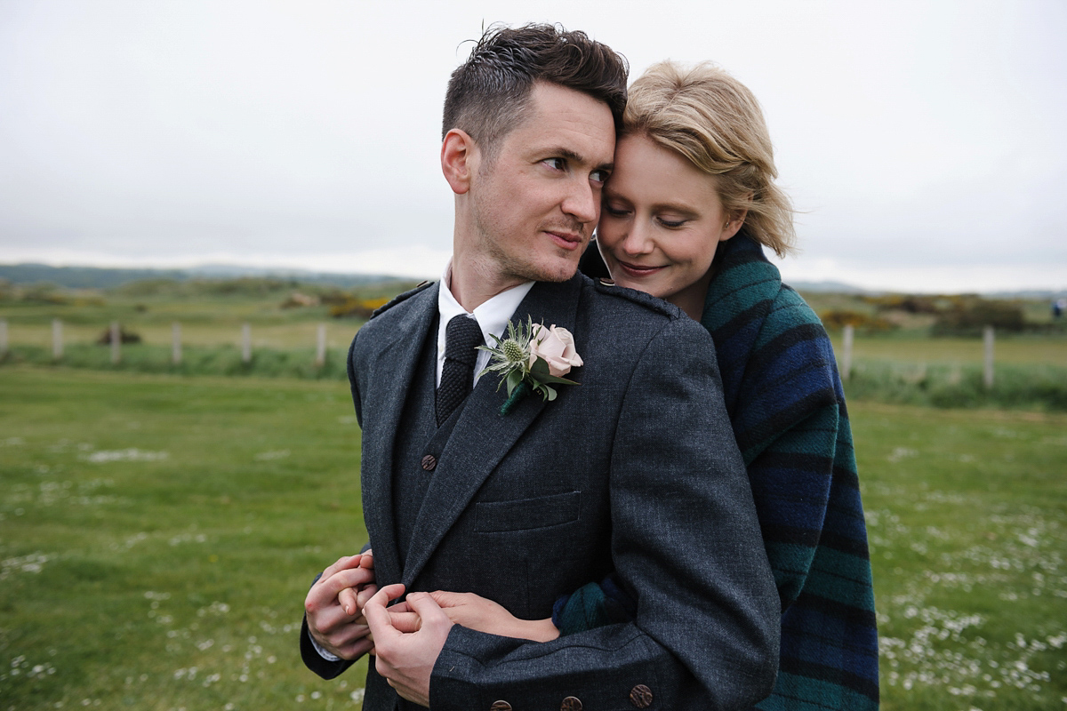 Laura wears a 1970's inspired Stone Cold Fox wedding dress for her laid back and organic beach wedding in Scotland. Photography by Tino and Pip.