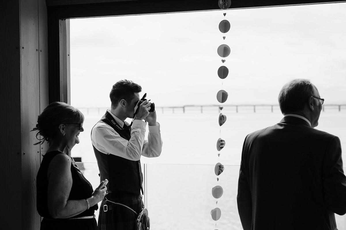 Laura wears a 1970's inspired Stone Cold Fox wedding dress for her laid back and organic beach wedding in Scotland. Photography by Tino and Pip.