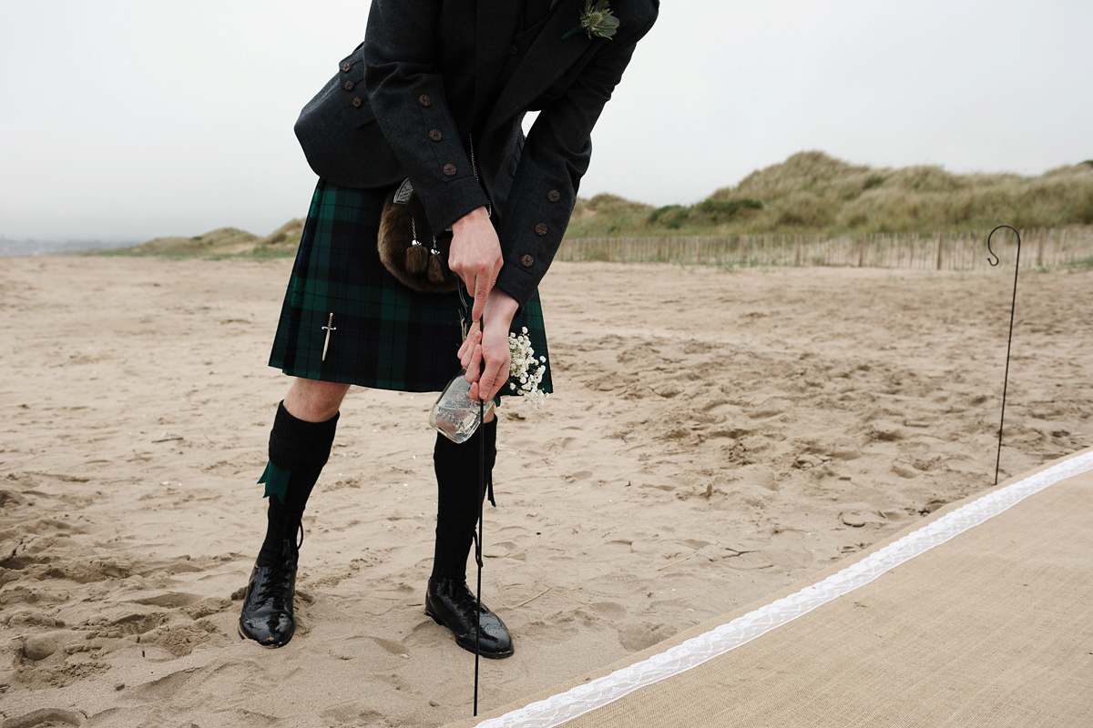 Laura wears a 1970's inspired Stone Cold Fox wedding dress for her laid back and organic beach wedding in Scotland. Photography by Tino and Pip.