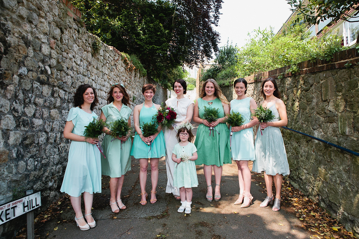 Sophie wore a Ghost dress for her elegant Spring wedding. Her bridesmaids wore mint green. Photography by Matilda Delves.