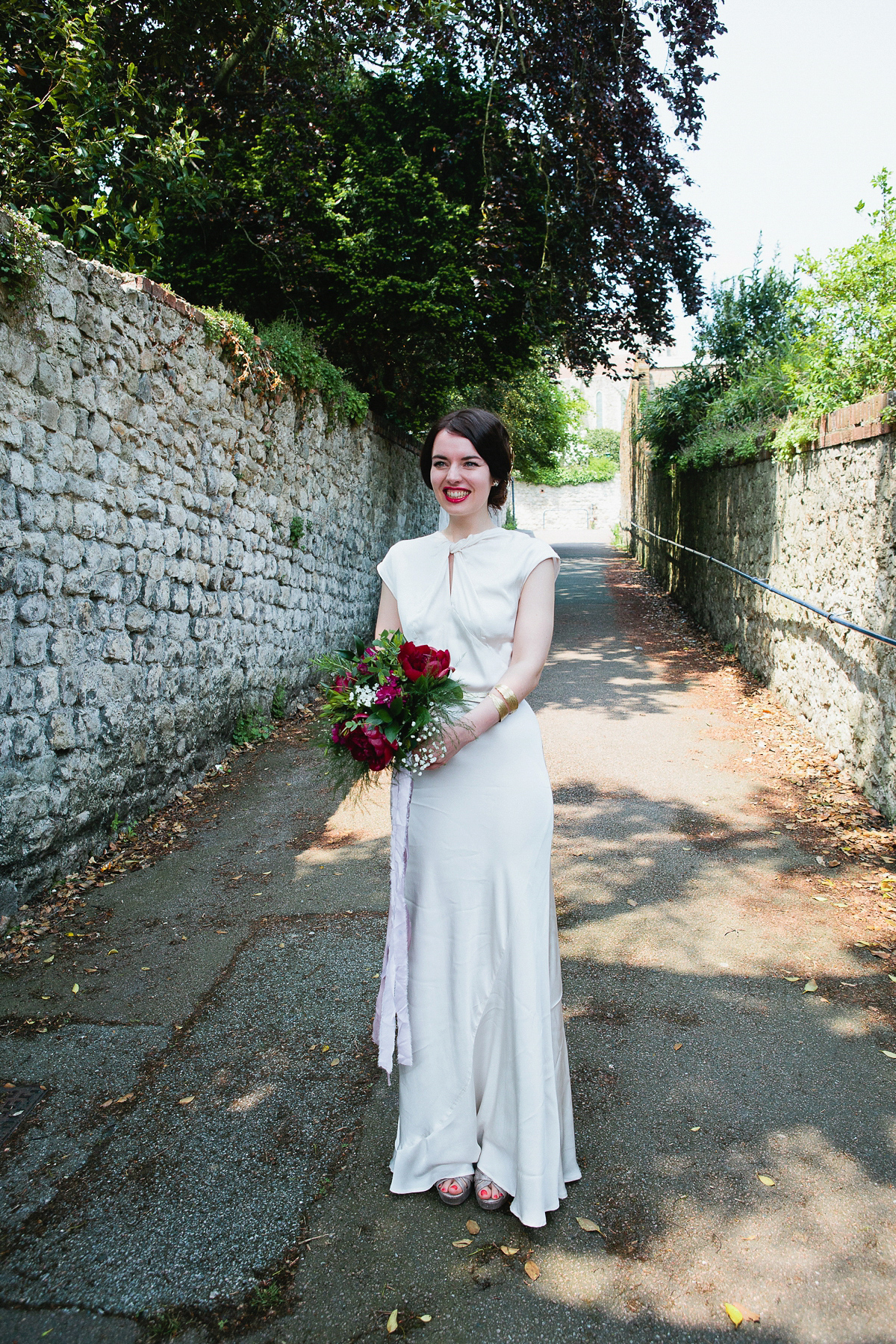 Sophie wore a Ghost dress for her elegant Spring wedding. Her bridesmaids wore mint green. Photography by Matilda Delves.