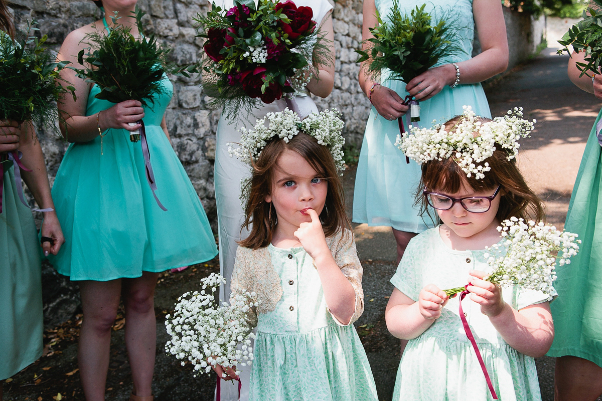 Sophie wore a Ghost dress for her elegant Spring wedding. Her bridesmaids wore mint green. Photography by Matilda Delves.