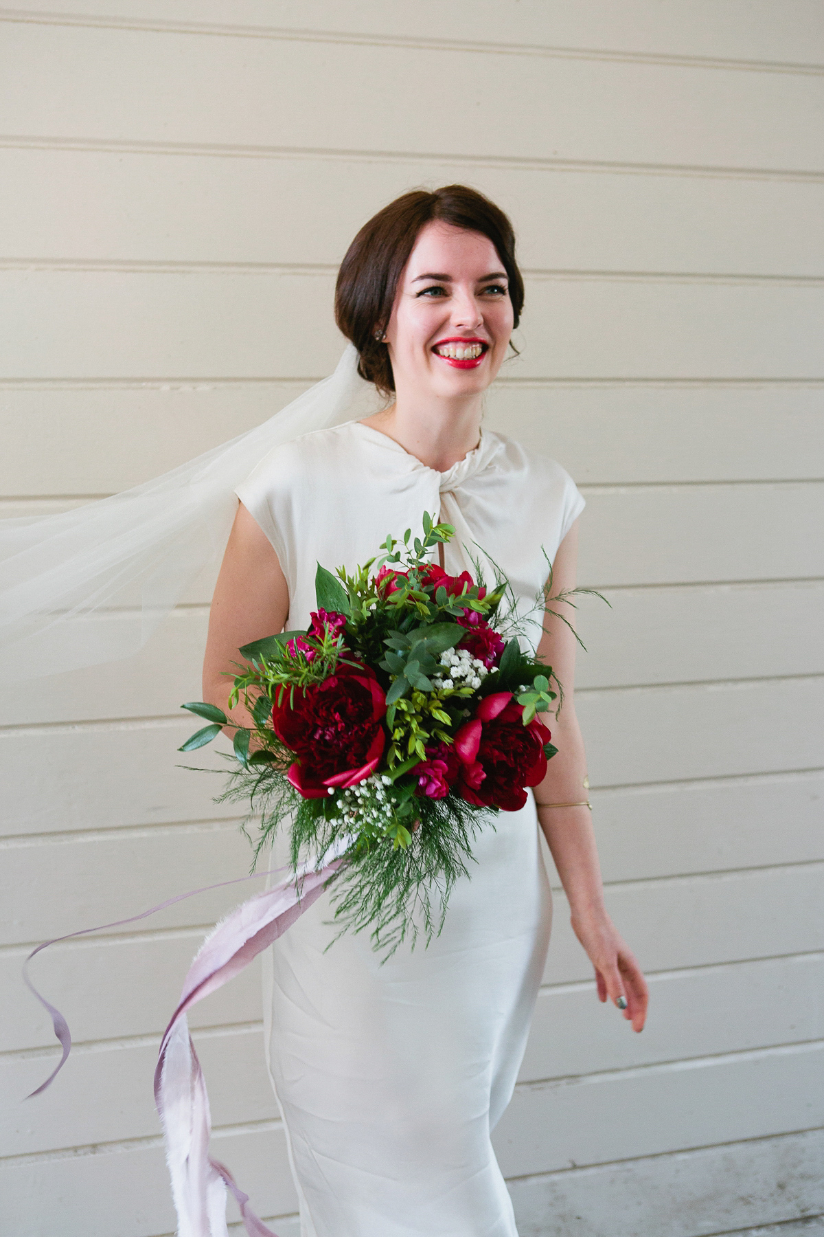 Sophie wore a Ghost dress for her elegant Spring wedding. Her bridesmaids wore mint green. Photography by Matilda Delves.