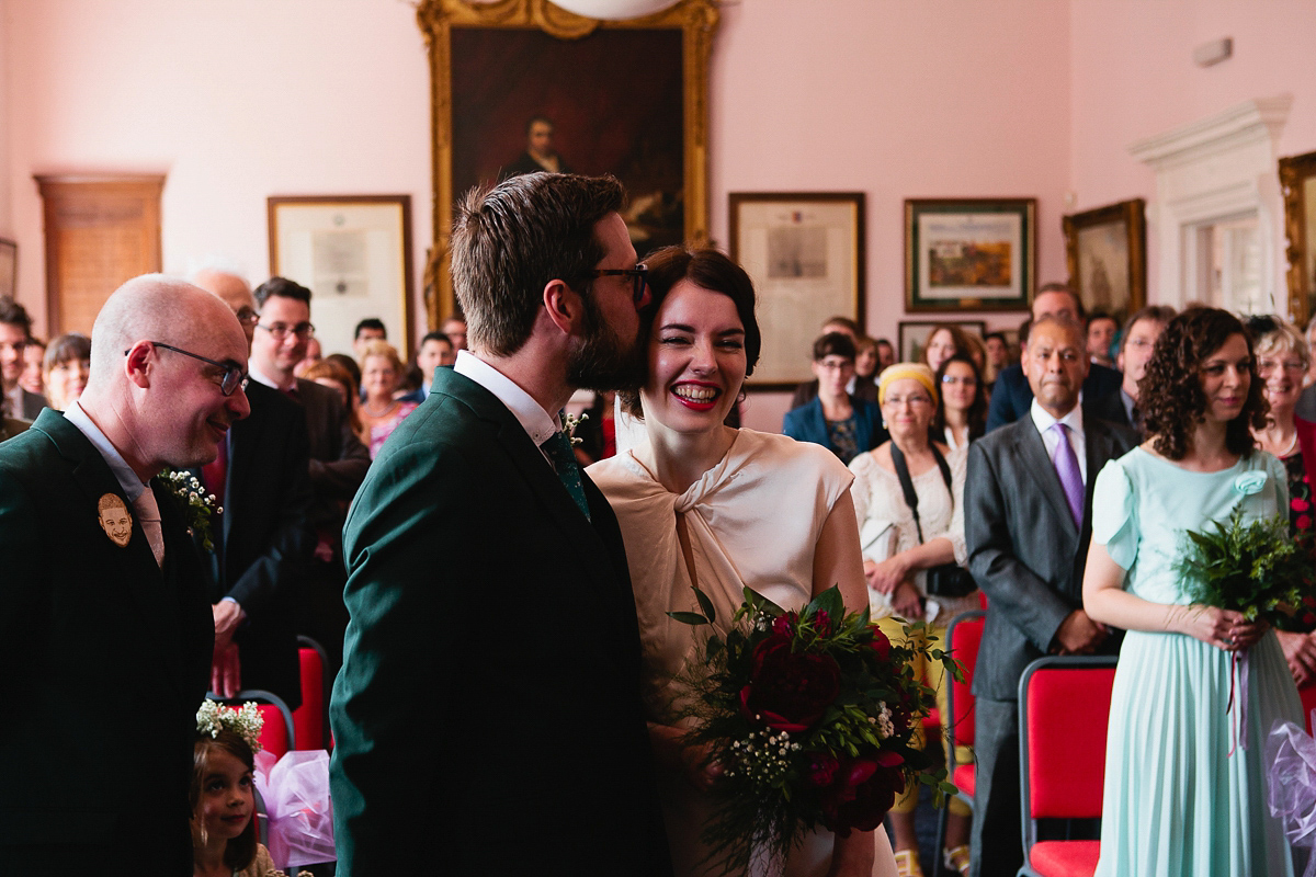 Sophie wore a Ghost dress for her elegant Spring wedding. Her bridesmaids wore mint green. Photography by Matilda Delves.