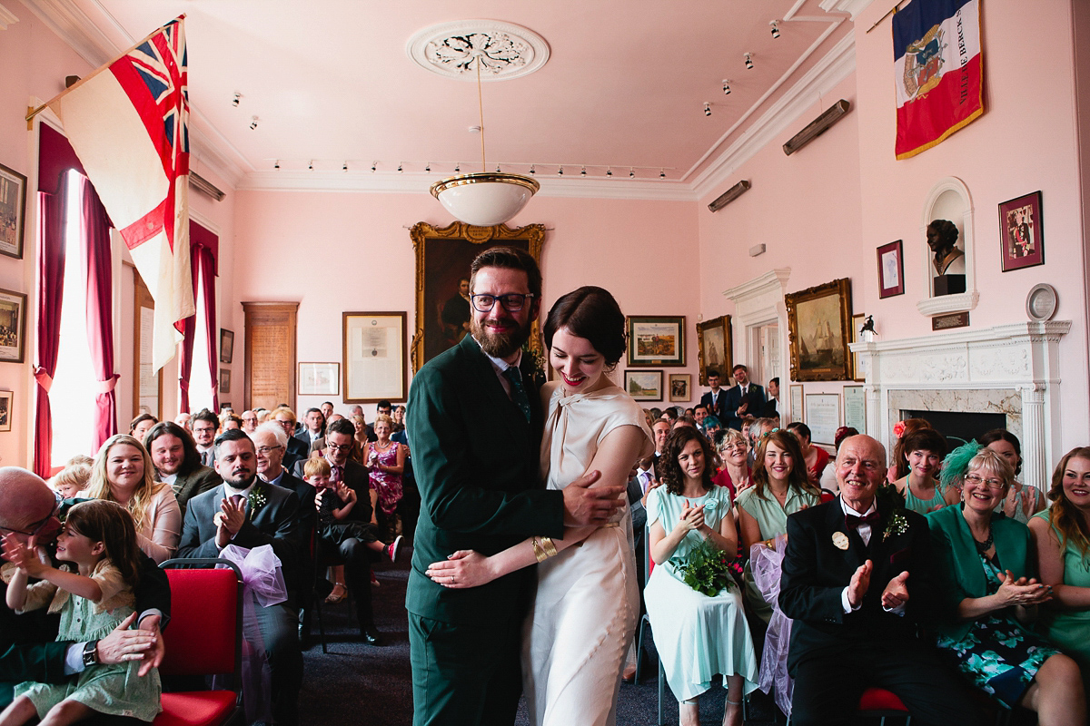 Sophie wore a Ghost dress for her elegant Spring wedding. Her bridesmaids wore mint green. Photography by Matilda Delves.