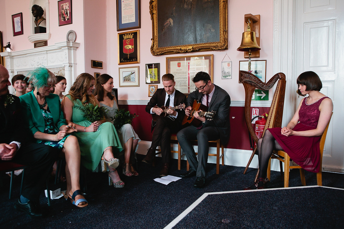 Sophie wore a Ghost dress for her elegant Spring wedding. Her bridesmaids wore mint green. Photography by Matilda Delves.