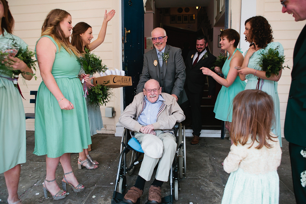 Sophie wore a Ghost dress for her elegant Spring wedding. Her bridesmaids wore mint green. Photography by Matilda Delves.