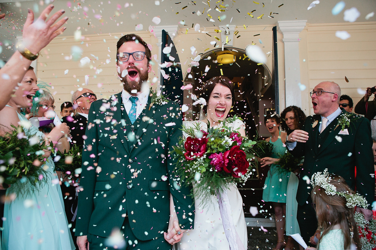 Sophie wore a Ghost dress for her elegant Spring wedding. Her bridesmaids wore mint green. Photography by Matilda Delves.