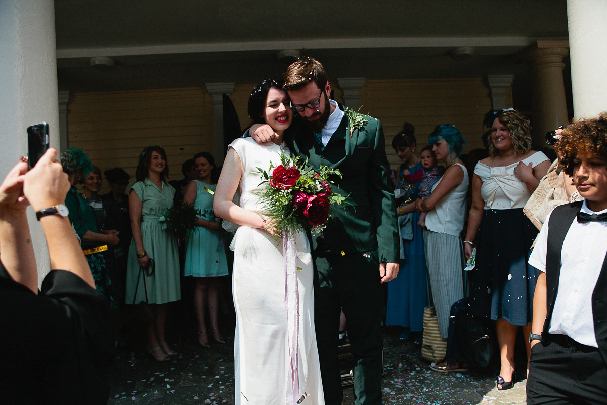 Sophie wore a Ghost dress for her elegant Spring wedding. Her bridesmaids wore mint green. Photography by Matilda Delves.