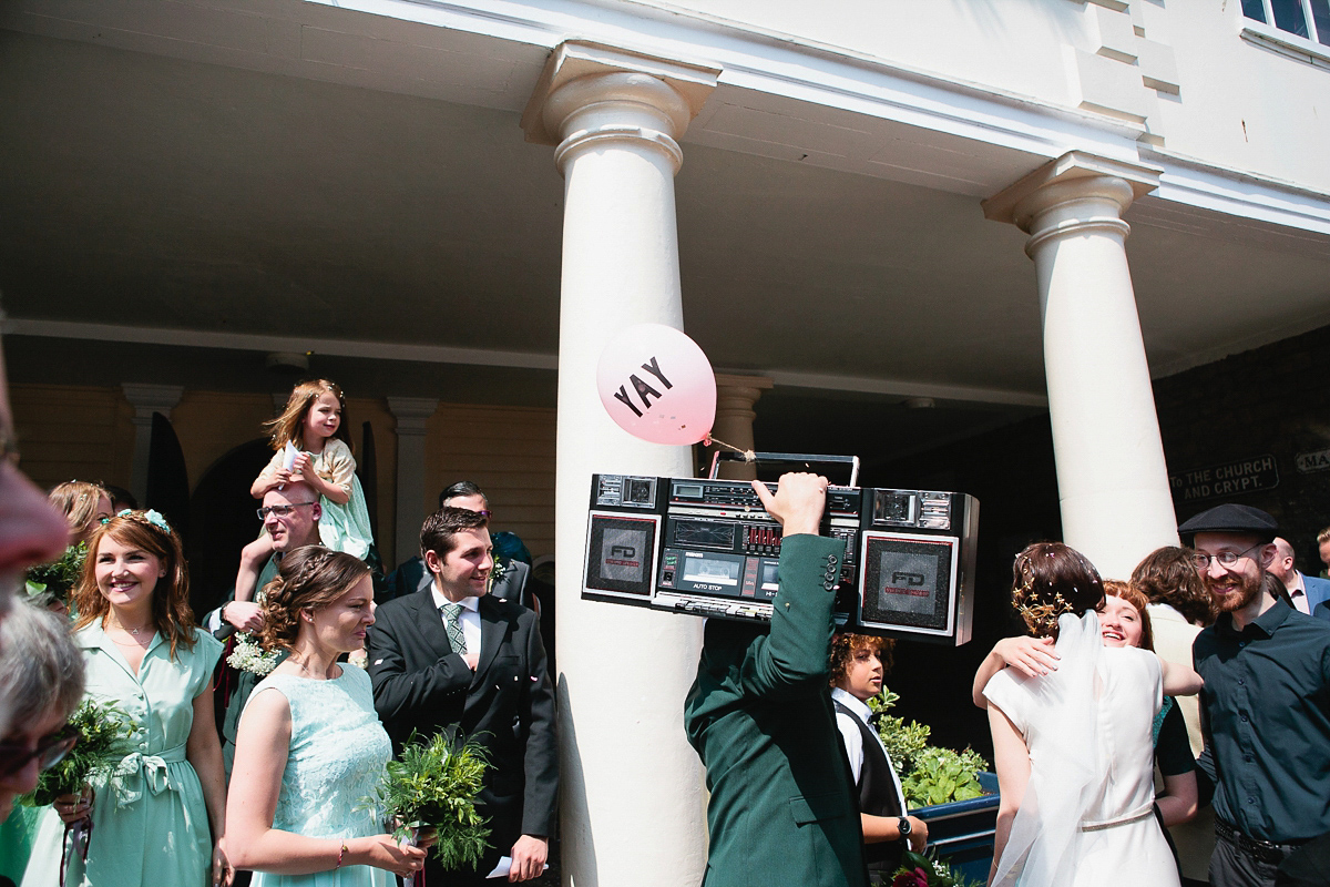 Sophie wore a Ghost dress for her elegant Spring wedding. Her bridesmaids wore mint green. Photography by Matilda Delves.