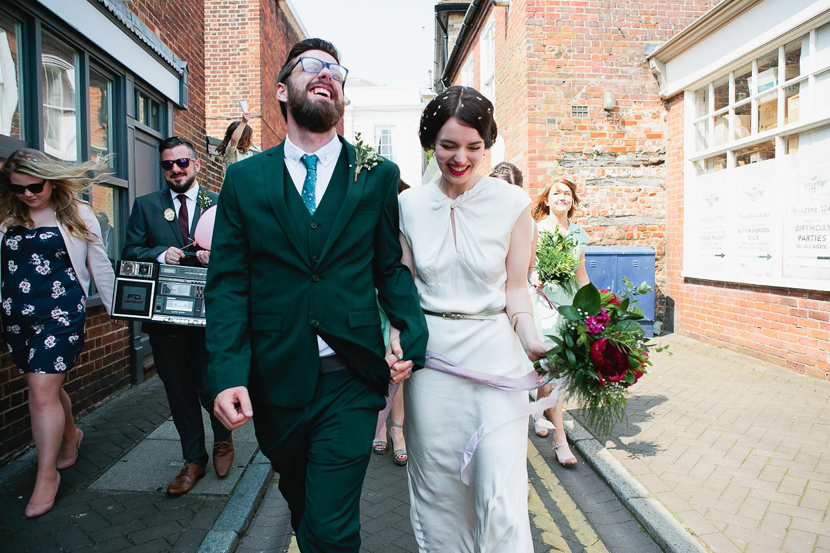 Sophie wore a Ghost dress for her elegant Spring wedding. Her bridesmaids wore mint green. Photography by Matilda Delves.