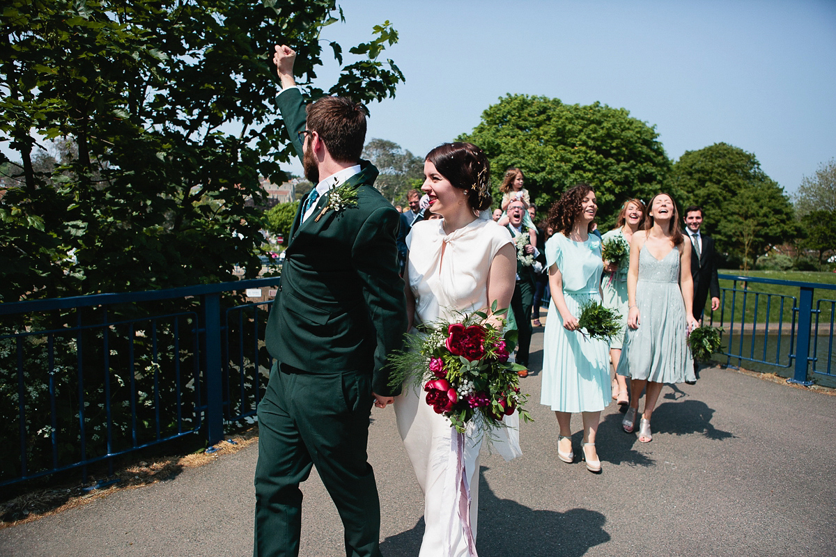 Sophie wore a Ghost dress for her elegant Spring wedding. Her bridesmaids wore mint green. Photography by Matilda Delves.