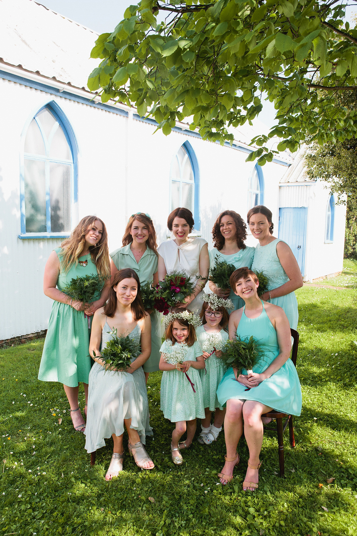 Sophie wore a Ghost dress for her elegant Spring wedding. Her bridesmaids wore mint green. Photography by Matilda Delves.