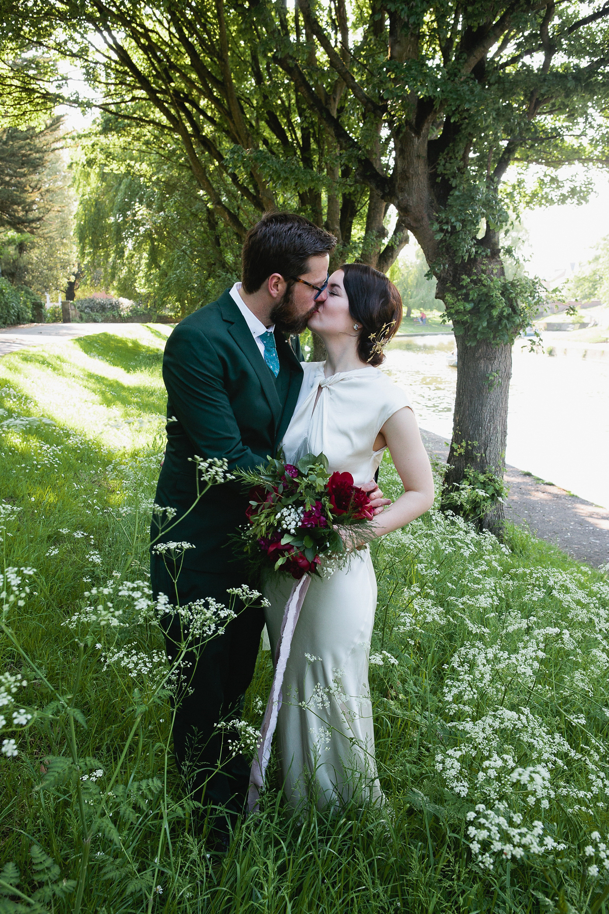 Sophie wore a Ghost dress for her elegant Spring wedding. Her bridesmaids wore mint green. Photography by Matilda Delves.