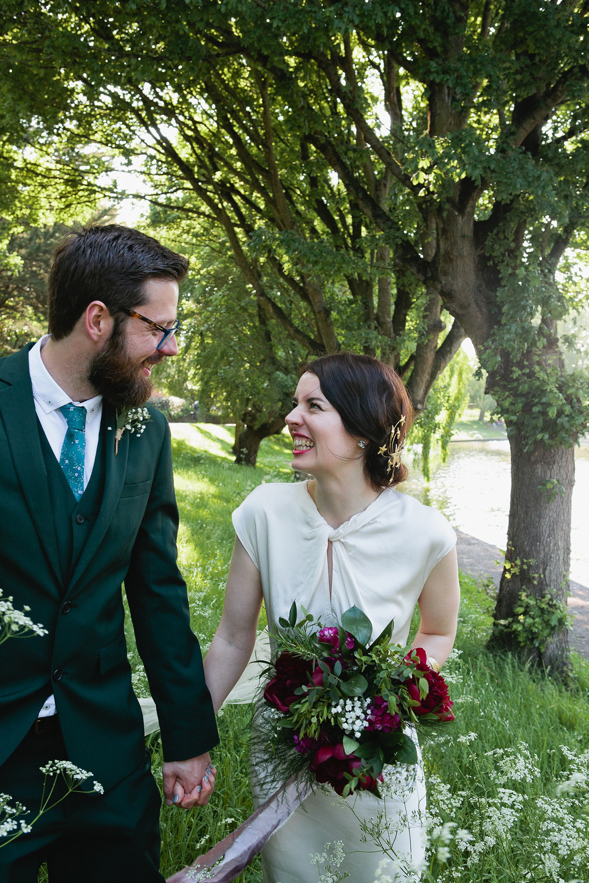 Sophie wore a Ghost dress for her elegant Spring wedding. Her bridesmaids wore mint green. Photography by Matilda Delves.